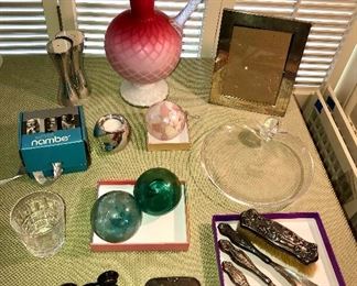 Pink mother of pearl glass pitcher, Nambe salt + pepper shakers & votive holder,  Tiffany sterling frame, Steuben snail bowl, glass floats, sterling vanity set