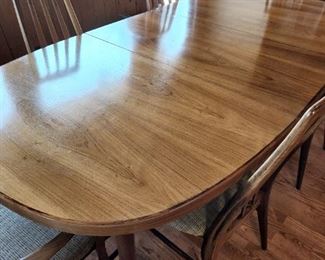 Rosewood Table and Chairs...Mid-Century Modern. Wonderul. Two leafs. 6 Mid-Century Modern Chairs. One leaf showing in photo.