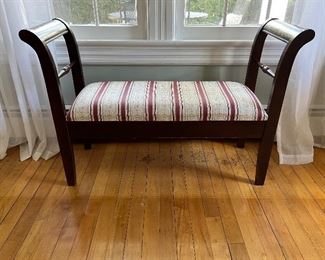 Curved armed upholstered bench with storage