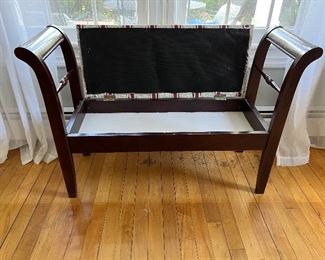 Curved armed upholstered bench with storage