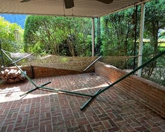 Metal based hammock stand with attached hammock