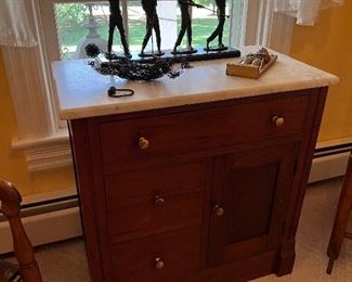 White Marble top vanity with 3 drawer and 1 door accented with brass drawer pulls