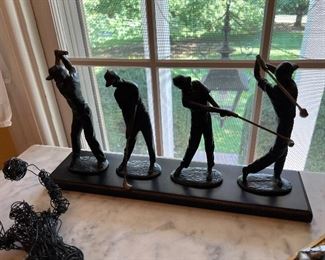Golfing statue