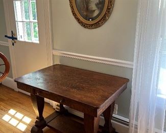 Antique 1 drawer accent table with Antique round wall art