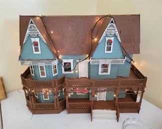 Adorable  dollhouse decorated for Christmas.