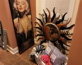 Marilyn Monroe Poster 62" x 21"; metal sun sculpture 45" diameter