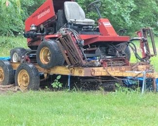 Golf course mower on trailer