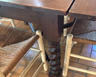 Barley twist legs; ends lower and tuck under the table for a smaller table size