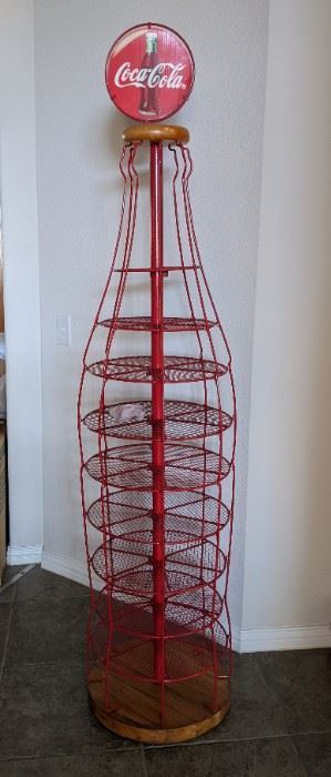 Unusual and large Coke bottle shaped wire display with wood base and top
