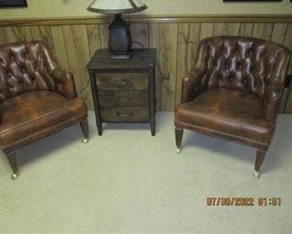 two small leather chairs