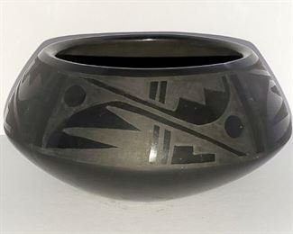 San Ildefonso Pueblo Indian Pottery. Very fine black on black pot with mirror glaze. 2 3/4" tall and 5 1/2" wide. Signed Blue Corn. By Crucita Gonzales Calabaza (1921-1999).