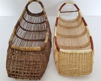 Two Hupa Karok Indian Sit Down Doll Cradle Baskets. One is an early basket dating back to the early 20th century. The other is a modern basket made from the old design. Doll size versions of the larger basket baby cradles.