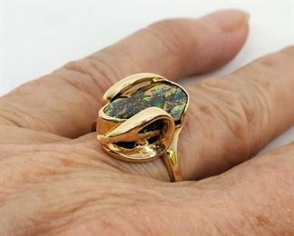 Lady's 14K Gold Australian Opal Ring Size 7 3/4. A designer ring with custom setting. Stone appears to be a black opal, but has not been tested.