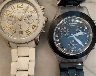 White Micheal Kors watch, Black Swatch watch