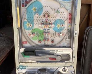 One (1) vintage Nishijin Super Deluxe Pachinko machine, unknown working condition, shows wear indicative of age and use, key to open glass is missing, H 33" x W 20.5" x D 4".