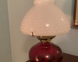 Cranberry glass lamp with milk glass hobnail shade