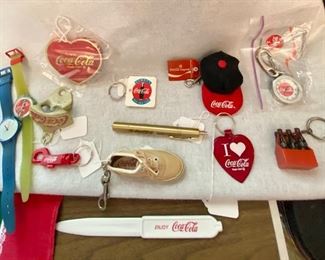 Various Coca-Cola Key Chains, watches, letter opener for Coca-Cola employees.