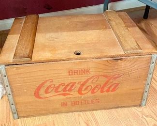 Coca-Cola Wooden Crate with some cans.