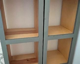 Pair of Cube Style Decorative Bookshelves. Raw wood finished with an exterior painted gray. Measuring 13.5" x 12" x 87" 