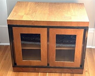 John Widdicomb Double Door Glass Front Accent Table in good condition with light wear to the surface. See lot 20 for an item in the same collection. 

Measures 27" x 18" x 22" 