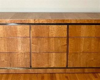 Mid Century Style John Widdicomb Dresser in a sleek and sylish design featuring a gorgeous wood grain and offering nine drawers. Item is in very good condition with light wear. See lot 21A for an item in the same collection. 

Measures 76" x 18" x 29"