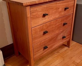 Room and Board Sherwood 3 Drawer Chest in a beautiful cherry finish with nice clean lines.  Built by North Dakota woodworkers, each piece in the Sherwood collection features solid wood and high-quality wood veneer sealed with a natural oil-and-wax finish. Drawers have dovetail joinery for enhanced durability. (Roomandboard.com)

Measures 36x19x34 inches. 