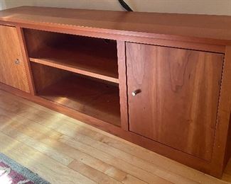 Room and Board Woodwind Media Cabinet has a warm classy look. It measures 70x17x24 inches. There is light wear to the top. 