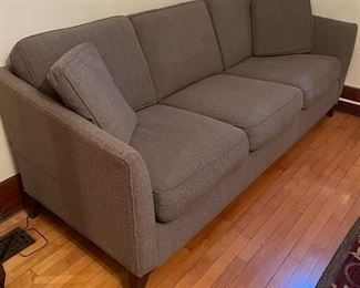 Very comfortable! This Gorgeous Grey Sofa from Room and Board comes with 2 Pillows and measures 85x34x35 inches and is in good condition with light wear. 