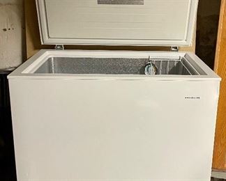 Fridgidaire Deep Freezer that measures 35x21x33 inches and the model number is FFFC07M2UW. There is a dent on the right side that can be seen in the photo gallery. Includes original manual. 
