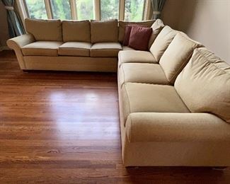 Beautiful Ethan Allen Upholstered Sectional in a lovely neutral tan color in very good condition with light wear. 

From the left, the sofa measures about 114" with the right side measuring 110". 