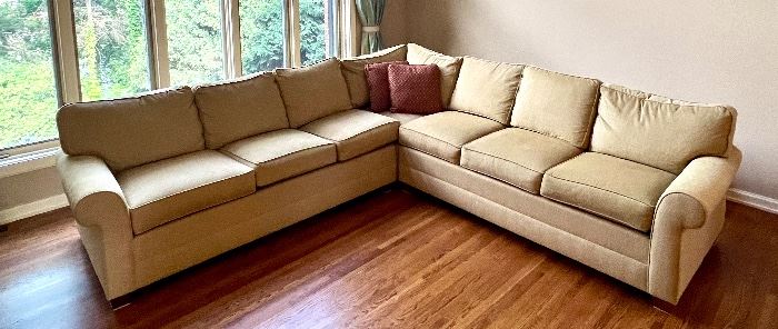 Beautiful Ethan Allen Upholstered Sectional in a lovely neutral tan color in very good condition with light wear. 

From the left, the sofa measures about 114" with the right side measuring 110". 