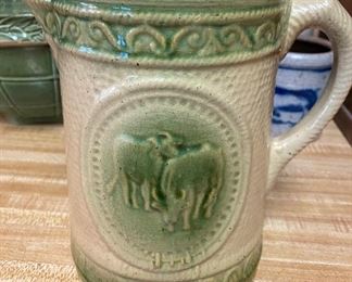 Cream and Green Stoneware Pottery Pitcher with Cows