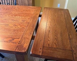 dining room table, with 1 leaf part way in.