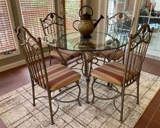 glass top table and metal chairs 