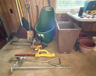 Large outdoor planters, long handled yard tools, hedge trimmer, chain saw