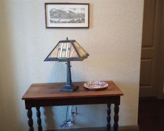 Beautiful entry table with Tiffany style lamp. Artwork