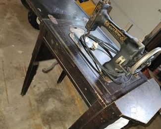 vintage Singer sewing machine and table.  This one is in the garage