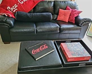 Black sofa,  storage ottoman. Coca cola collectible 