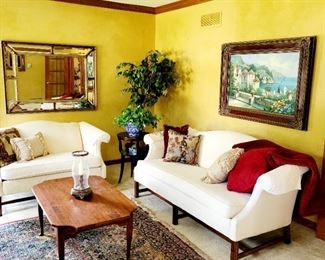 Camel back sofa, camel back love sea, coffee table, rug, art mirrors 