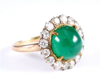 A Victorian 18k Yellow Gold, Emerald and Diamond ring.  Consists of a center round cabochon genuine Emerald stone measuring 10mm, surrounded by sixteen full cut side Diamonds, each approx. 1ct with AGS 6/P color and 6/SI2 clarity.  Gold mark worn away.  4.8 grams total.  Some surface wear, Emerald with some fracture lines.  Size 6 1/4. 