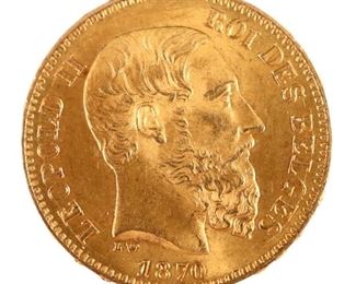 An 1870 Belgian .900 Gold Leopold II 20 Franc coin.  Features the portrait of Leopold II with Belgian coat of arms and the inscription "L'UNION FAIT LA FORCE" on reverse.  6.4 grams total.  Minor wear.  3/4" diameter.