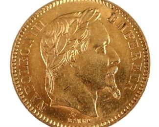 An 1866 French .900 Gold Napoleon III 20 Franc coin.  Features the portrait of Napoleon III with the French coast of arms and the inscription "EMPIRE FRANCAIS" on reverse.  6.5 grams total.  Minor wear.  3/4" diameter. 