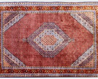 An 8' x 10.8' Iranian Bidjar carpet.  Hand-woven multicolor geometric design with central medallion on a Red field.  Minor wear and fading.  ESTIMATE $600-800  NOTE: Includes Certificate of Appraisal from Hagopian World of Rugs, dated July 1997 in Birmingham, MI.
