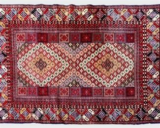 A 6.5' x 9.8' Afghan Kabul carpet.  Hand-woven multicolor geometric design with central medallion on a Red field.  Some wear to edges, minor fading.  ESTIMATE $400-600  NOTE: Includes Certificate of Appraisal from Hagopian World of Rugs, dated July 1996 in Birmingham, MI.

