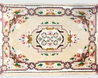 A 2.1' x 3.1' Indian Aubusson style rug.  Hand-woven multicolor field with central medallion and floral border.  Wear to edges, minor fading.  ESTIMATE $100-200  NOTE: Includes Certificate of Authenticity from Mir's Oriental Rugs Inc., dated April 1998 in Ann Arbor, MI.
