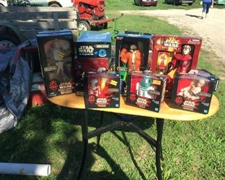 15 Star Wars collectibles in boxes