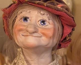Funny faced old woman doll