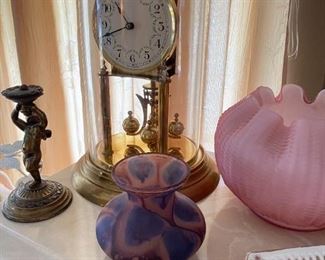 Anniversary clock and art glass vase.