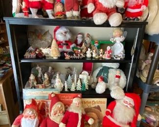 A display of Santas and Christmas items.