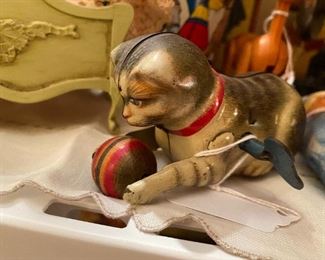 Antique tin cat and ball wind-up toy.